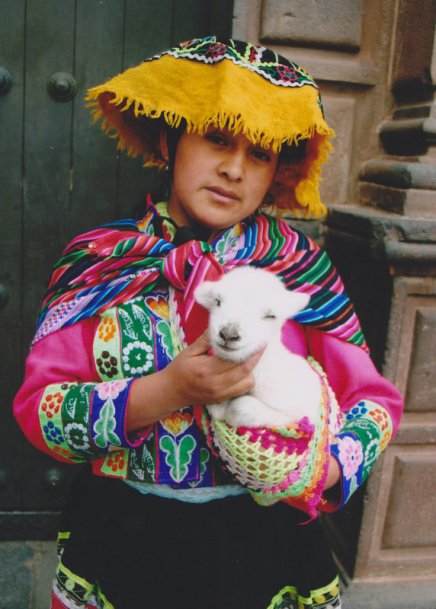 Indian_girl_with_a_young_alpaca_in_Peru