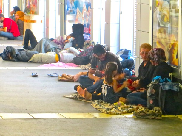 Refugees line walls of Belgrade bus station