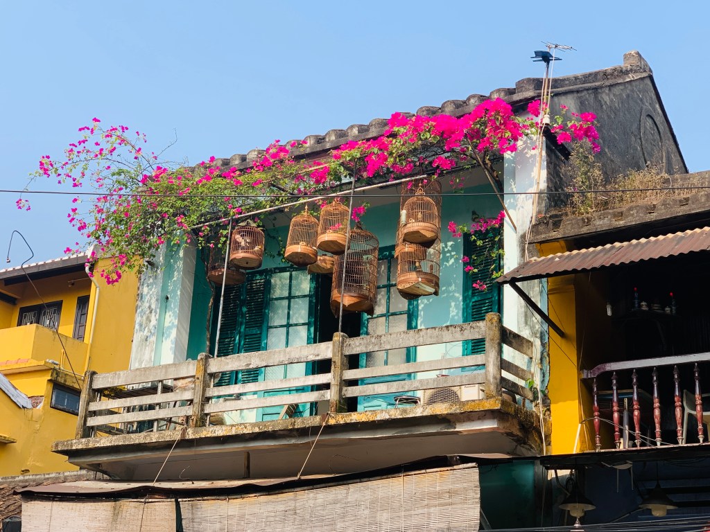 Bird cages on balcony in Hoi An, Vietnam
